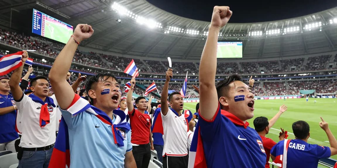 ราคาบอลโลกนัดชิง และแฟนบอลชาวไทย celebrating at the stadium during FIFA World Cup 2026